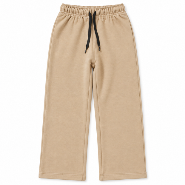 Front view of boys and girls beige terry trousers with straight-leg fit, front seams and black drawstring waist