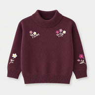 Front view of a deep-plum cotton mock-neck sweater for girls, featuring pink and white floral embroidery across the chest and long sleeves.