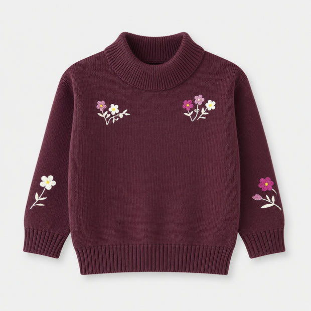 Front view of a deep-plum cotton mock-neck sweater for girls, featuring pink and white floral embroidery across the chest and long sleeves.