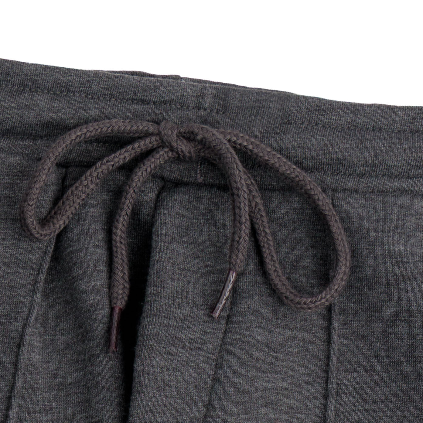 Close-up of the elasticated waistband and matching braided drawstring on the kids charcoal fleece joggers.