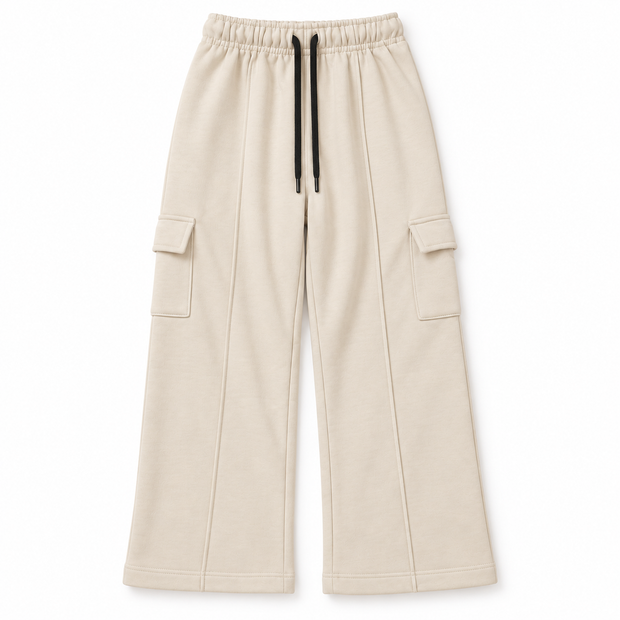 Front view of boys and girls cream terry cargo trousers with wide-leg fit, side flap pockets and black drawstring waist