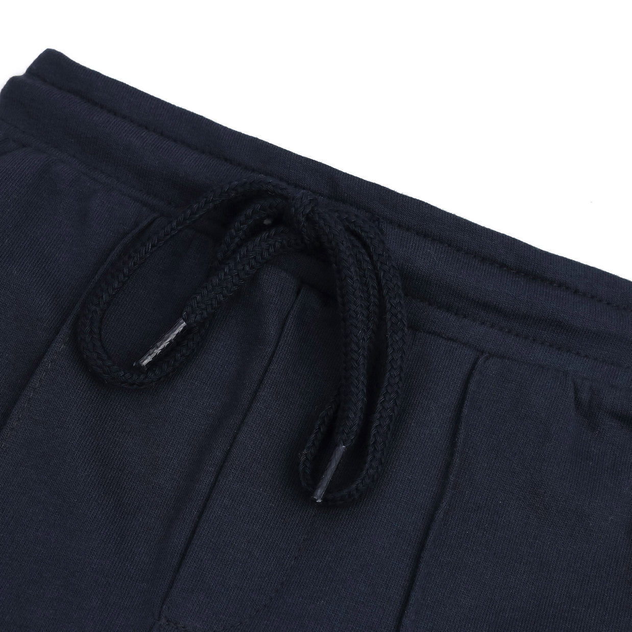 Close-up of the elasticated waistband and matching braided drawstring on the boys navy fleece joggers.