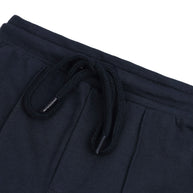 Close-up of the elasticated waistband and matching braided drawstring on the boys navy fleece joggers.