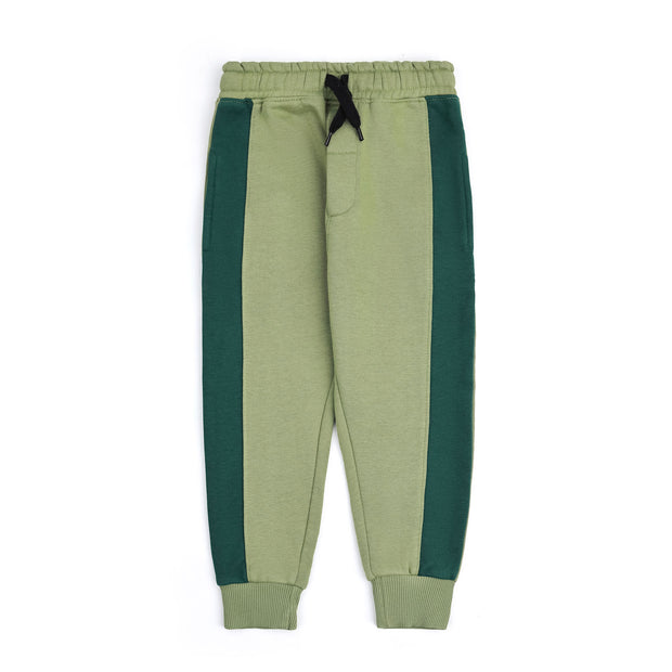 Sage green fleece joggers for boys with dark green color block side panels, a black drawstring, side pockets and ribbed ankle cuffs.