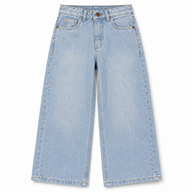 Front view of girls light blue wide-leg denim jeans with scattered rhinestone embellishments and classic five-pocket styling