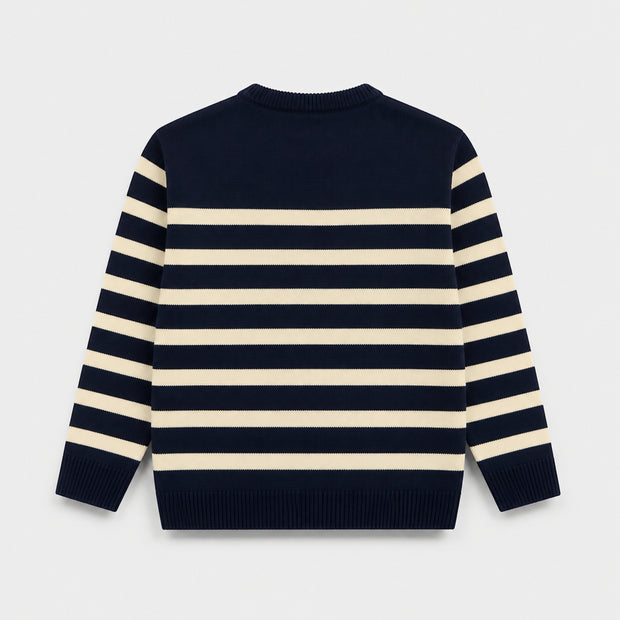 Back view of a boys Atlantic Navy and cream striped acrylic sweater displaying horizontal stripes across the body and sleeves.