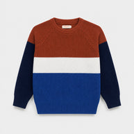 Front view of the Color Block Sweater for boys, featuring rust, white, royal blue and Navy blue sections with raglan sleeves and ribbed finishes.