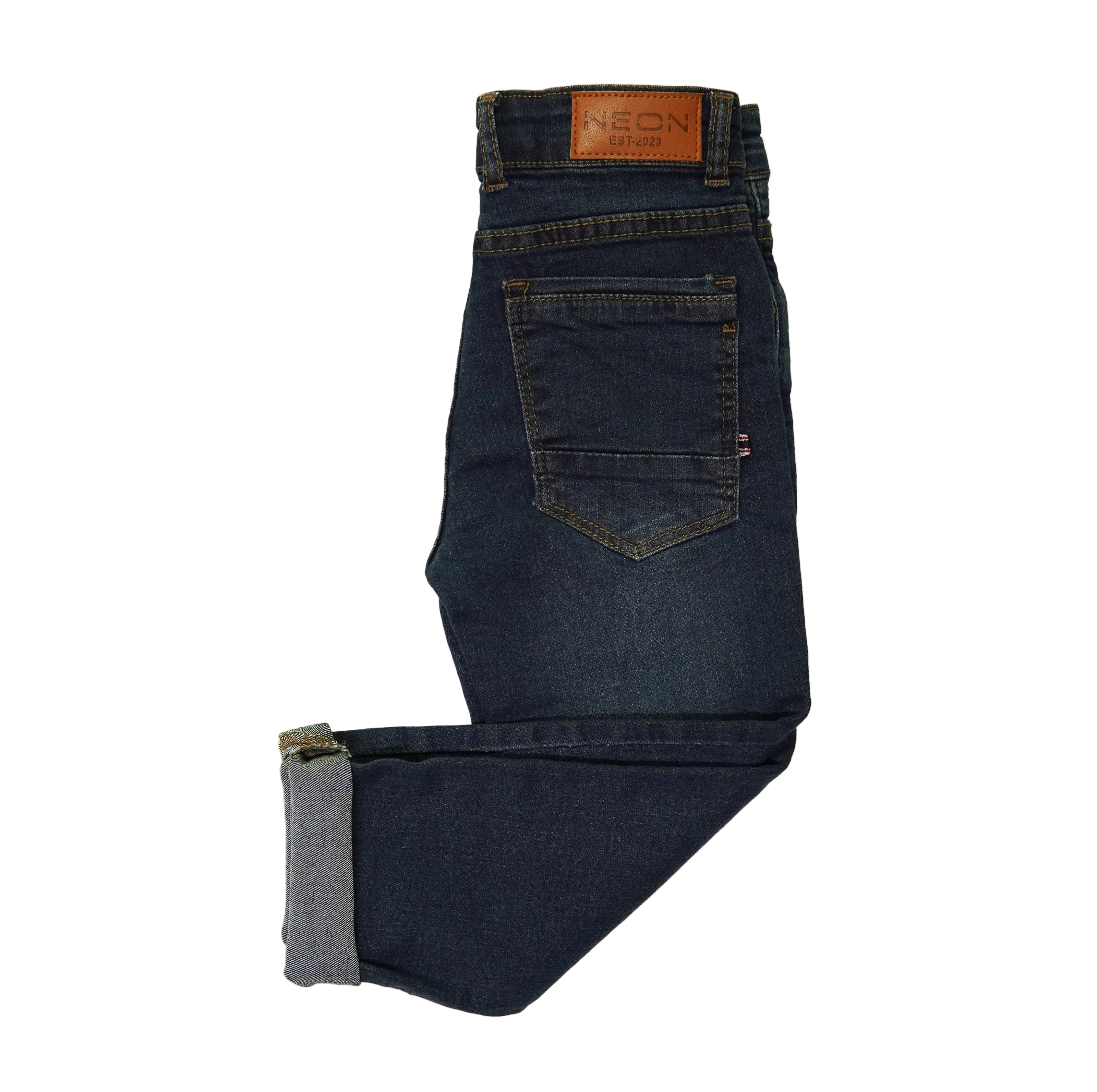 Back view of the kids dark indigo denim showing the back pocket, cuffed hem and branded waist patch.