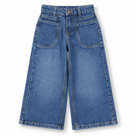 Front view of girls medium blue washed wide leg jeans with large front patch pockets