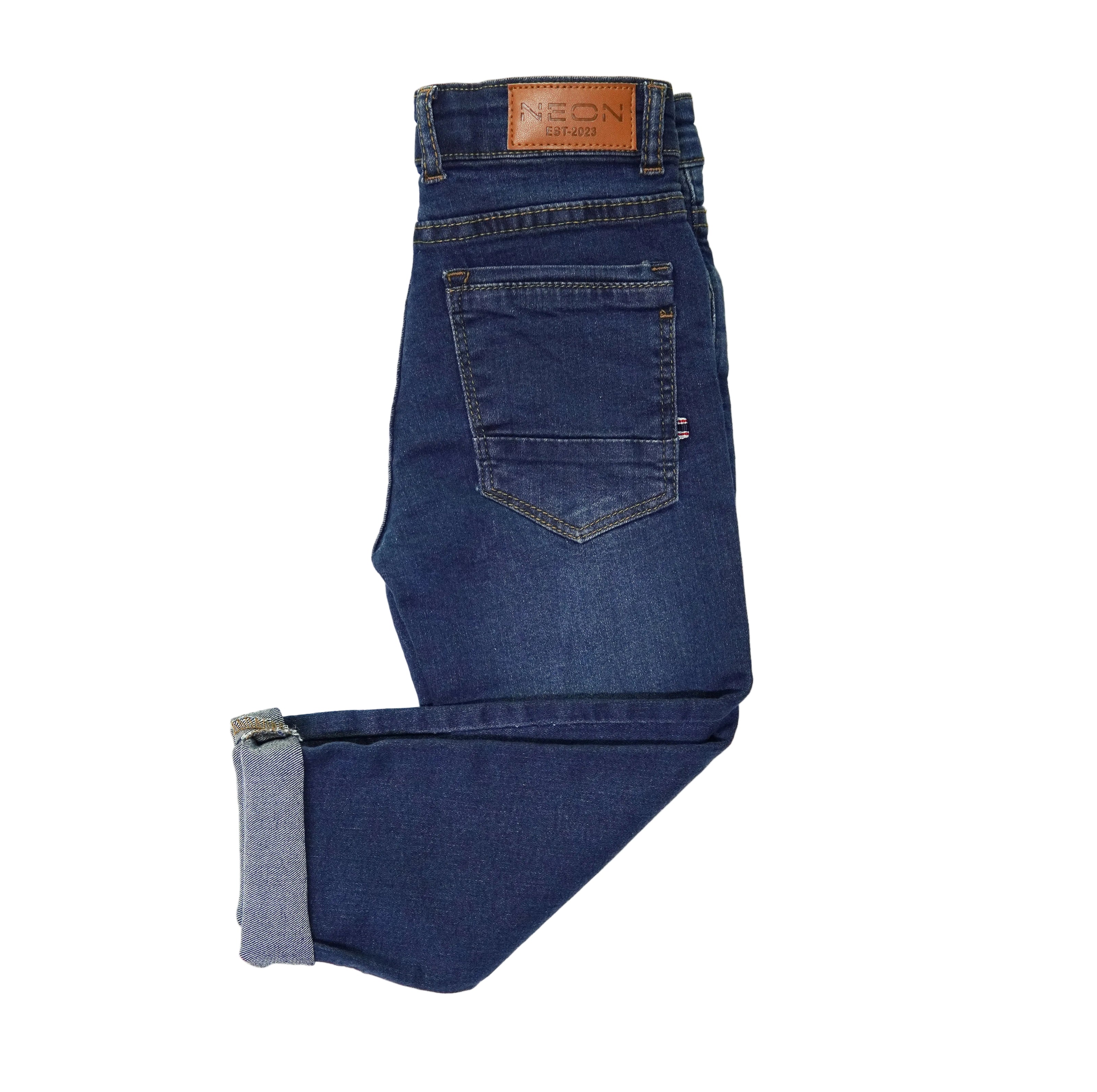 Back view of the kids classic blue denim showing the back pocket, cuffed hem and branded waist patch.