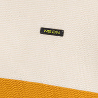 Close-up view of the off-white and mustard cotton texture with the contrast NEON logo detail on the boys color block sweater.