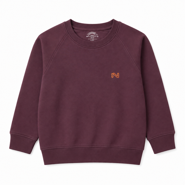 Front view of the boys burgundy fleece sweatshirt featuring a small orange embroidered N logo, round ribbed neckline and raglan sleeves.