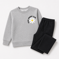Complete view of the girls fleece co-ord set featuring a grey Good Energy Club daisy sweatshirt with black wide-leg drawstring trousers.
