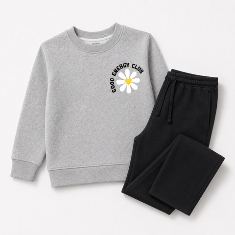 Complete view of the girls fleece co-ord set featuring a grey Good Energy Club daisy sweatshirt with black wide-leg drawstring trousers.