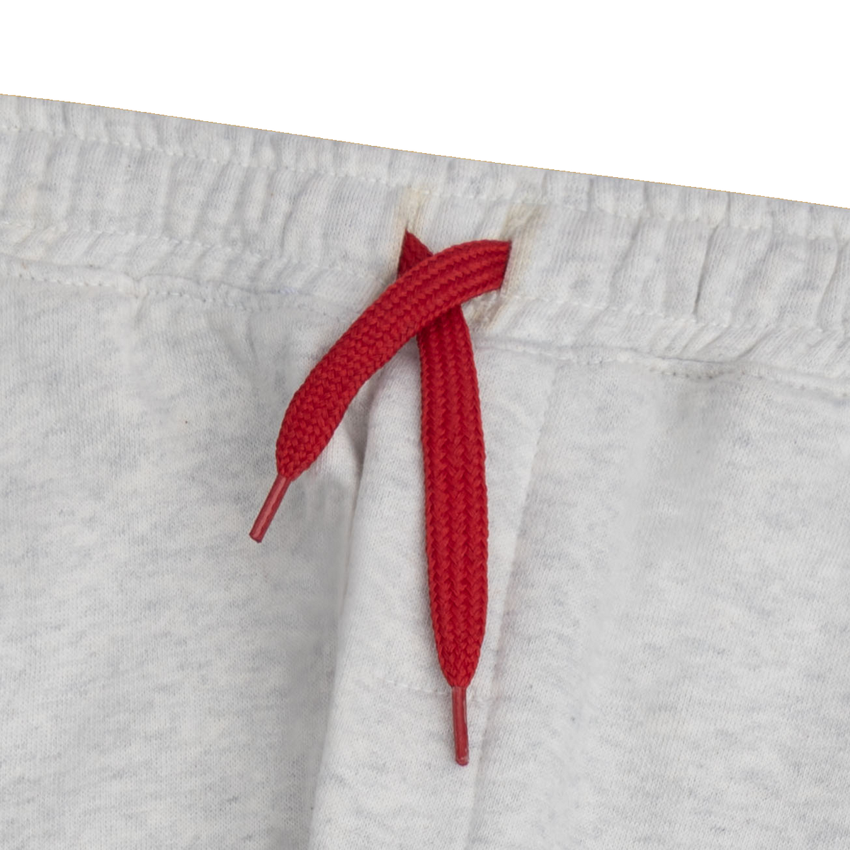 Close-up of the elasticated waistband and contrast red drawstring on the boys grey cargo jogger.