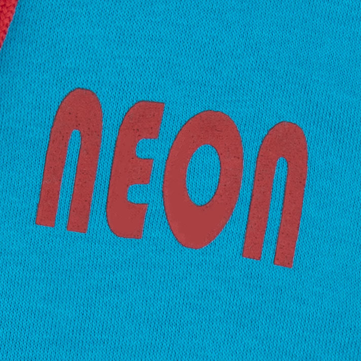 Close-up of the red NEON chest graphic printed on the boys turquoise blue sleeveless fleece zip-up hoodie.