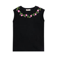 Front view of the girls black sleeveless rib top featuring colorful pink floral embroidery around the round neckline.