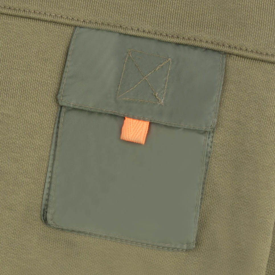 Close-up of the dark sage flap chest pocket and contrast orange pull tab on the boys olive fleece sweatshirt.
