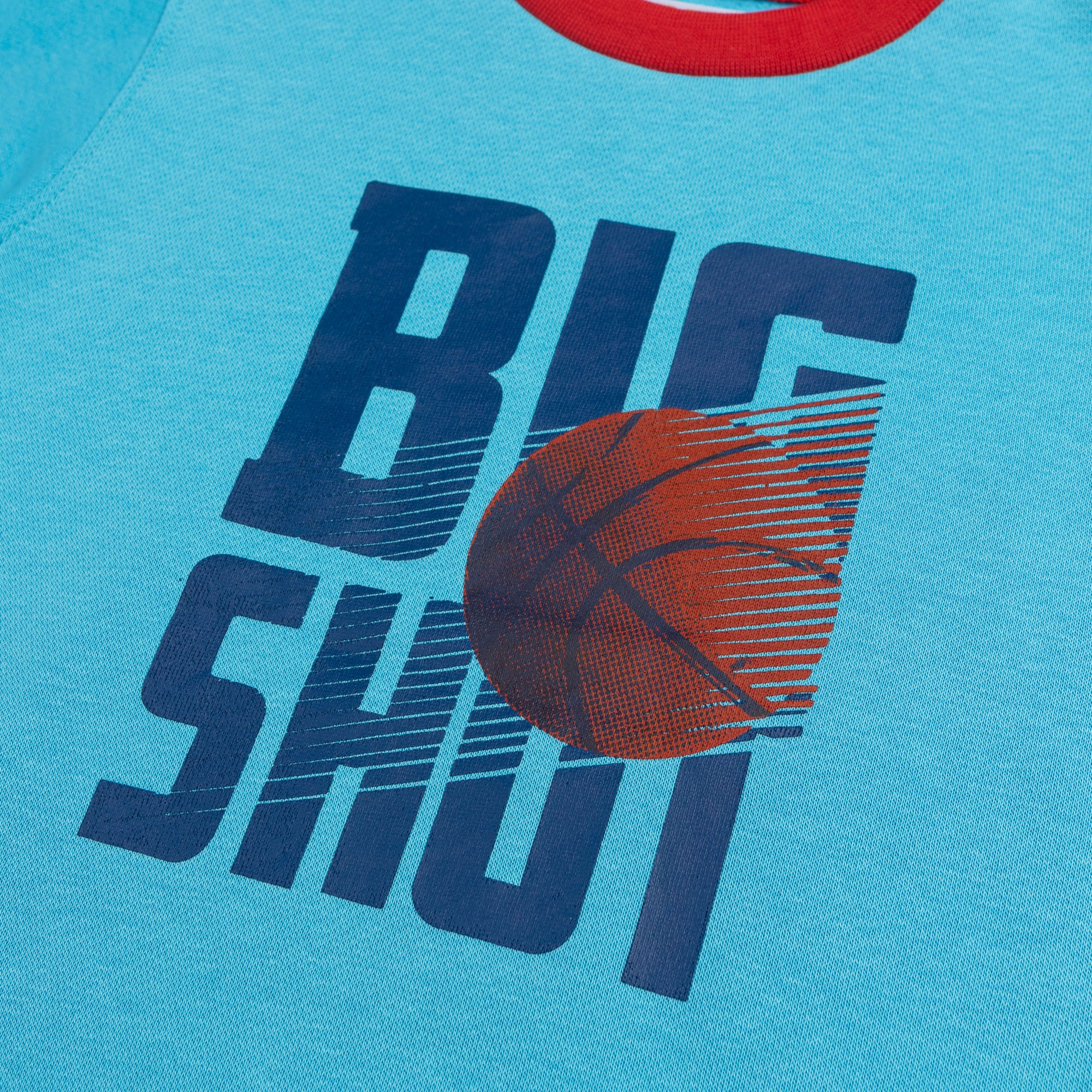Close-up of the navy blue and orange Big Shot basketball graphic printed on the boys turquoise fleece sweatshirt.