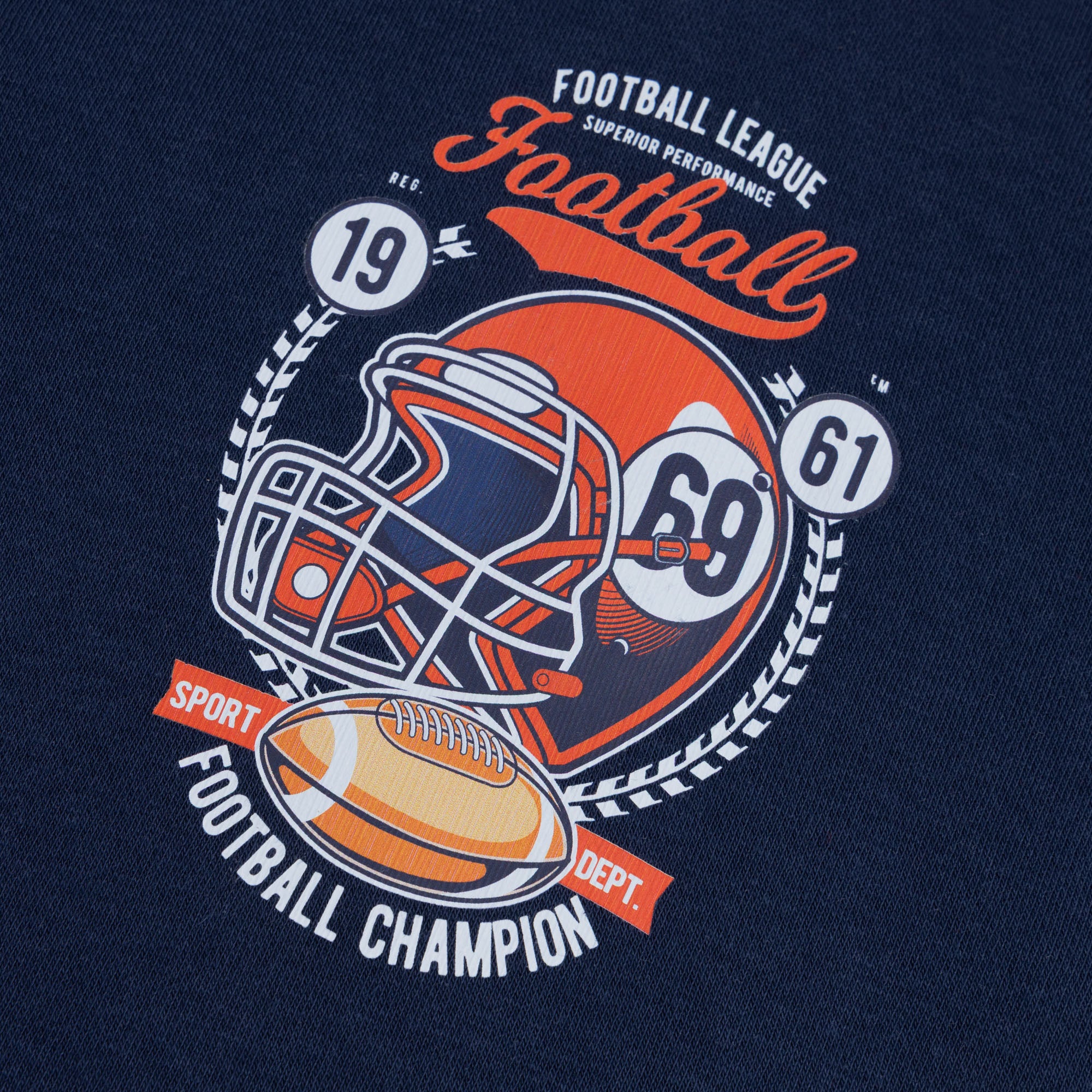 Close-up of the orange, white and red football helmet graphic printed on the navy boys’ hoodie.