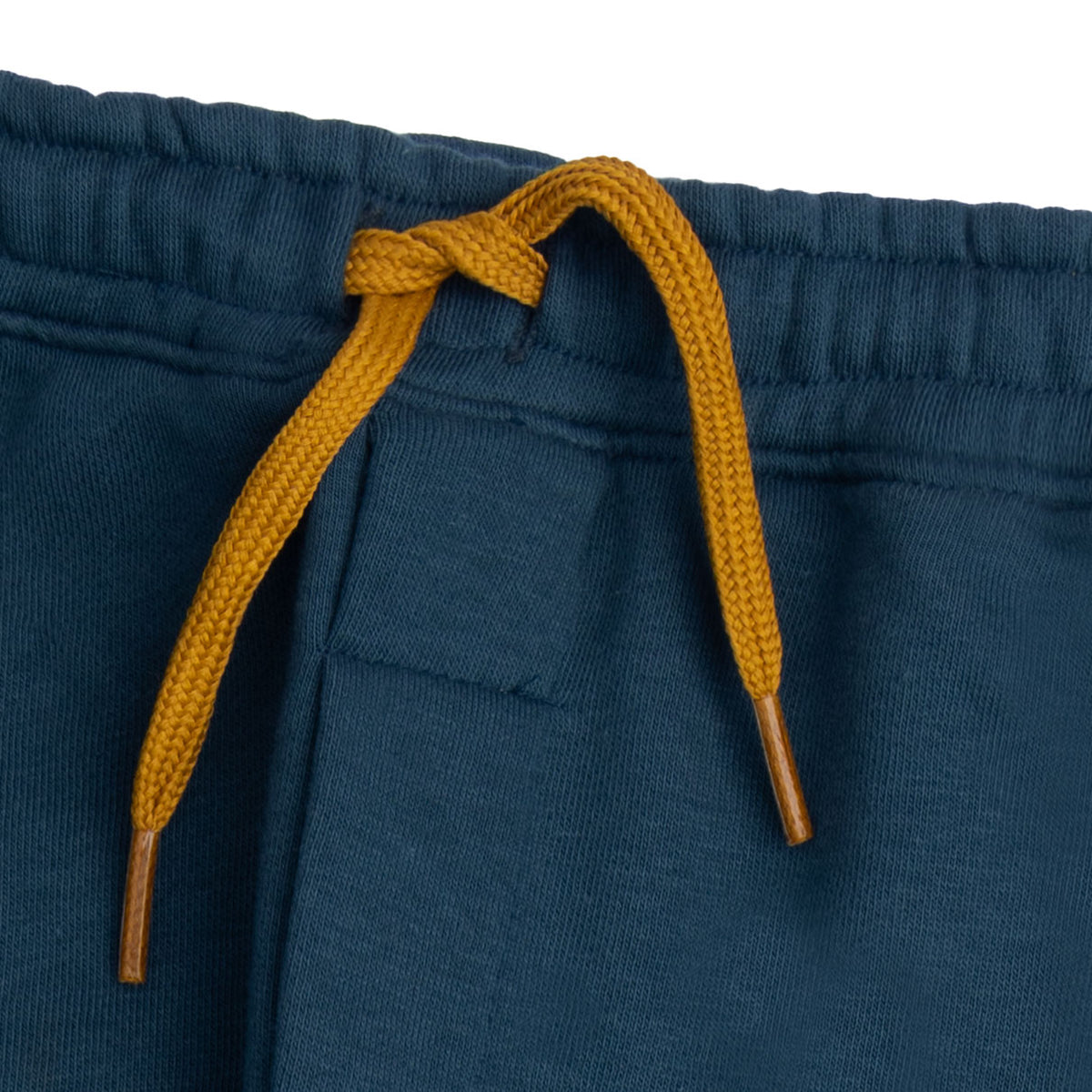 Close-up of the elasticated waist and mustard drawstring with metal tips on the deep teal boys cargo joggers.