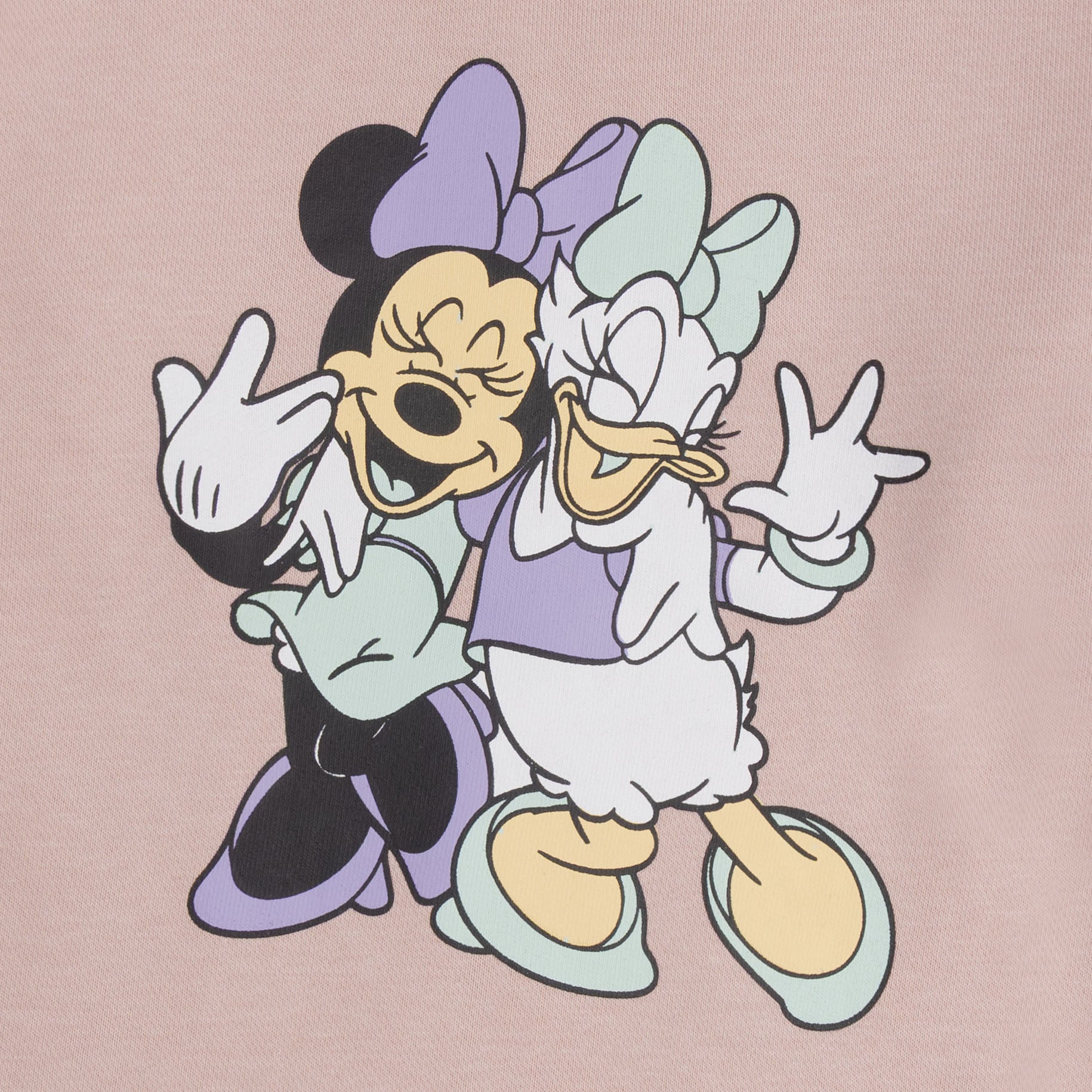 Close-up view of the Minnie Mouse and Daisy Duck graphic in lavender, mint, white and yellow on the girls pink fleece sweatshirt.