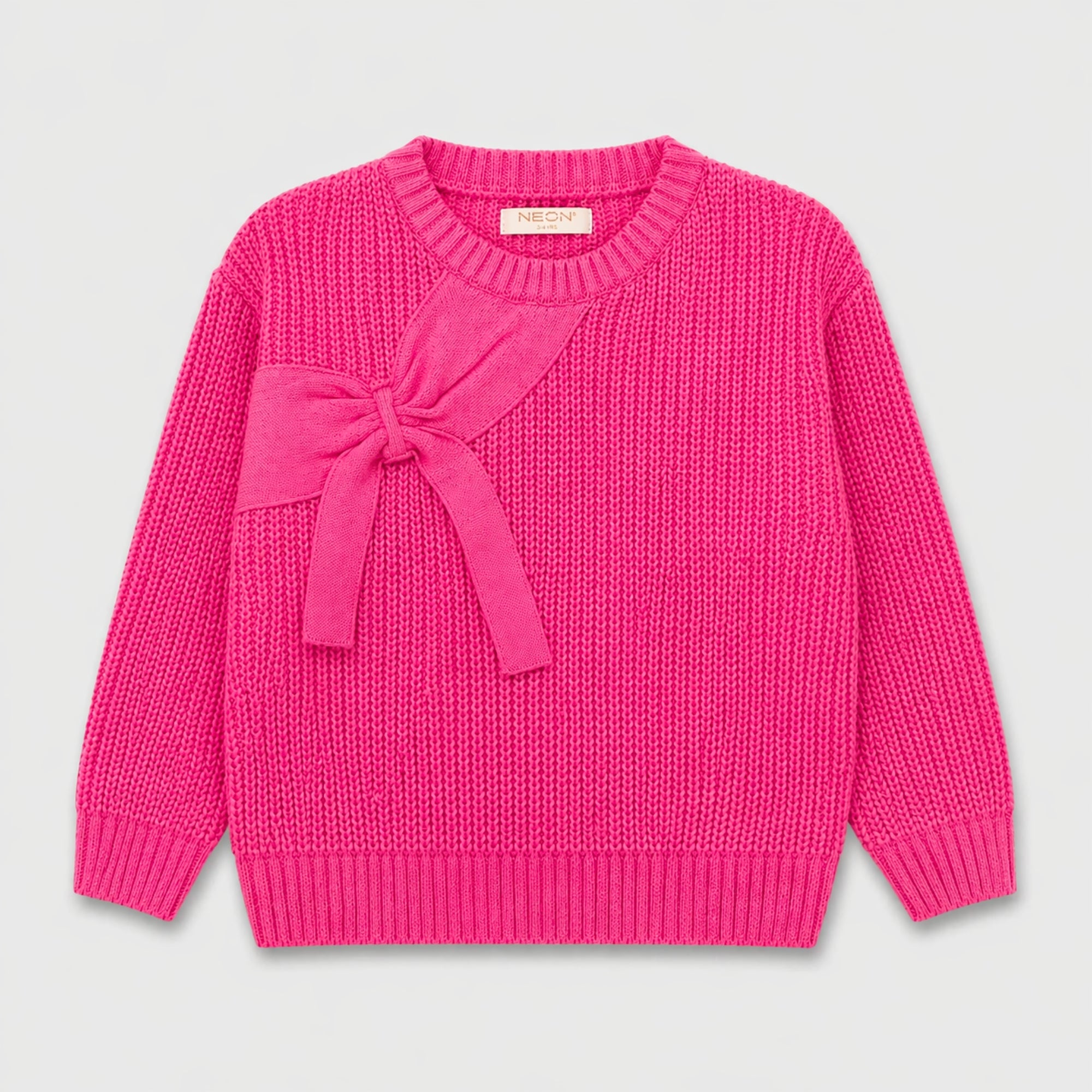 Front view of a hot pink girls sweater featuring a textured finish, decorative bow detail, round ribbed neckline and long sleeves.