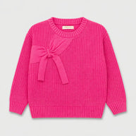 Front view of a hot pink girls sweater featuring a textured finish, decorative bow detail, round ribbed neckline and long sleeves.