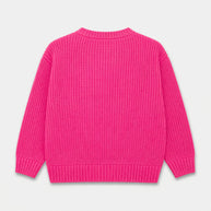 Back view of the hot pink girls acrylic sweater showing its plain textured design, long sleeves and ribbed cuffs and bottom.