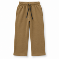 Front view of girls camel brown fleece trousers with side pockets and black drawstring waist