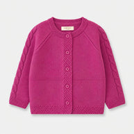 Front view of the Cable Knit Button-Down Cardigan for girls, featuring cable-knit raglan sleeves, a round neckline and matching deep pink buttons.