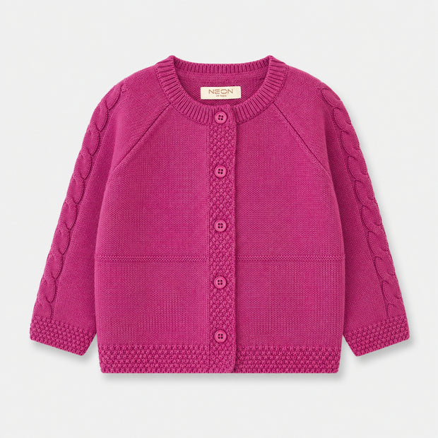 Front view of the Cable Knit Button-Down Cardigan for girls, featuring cable-knit raglan sleeves, a round neckline and matching deep pink buttons.