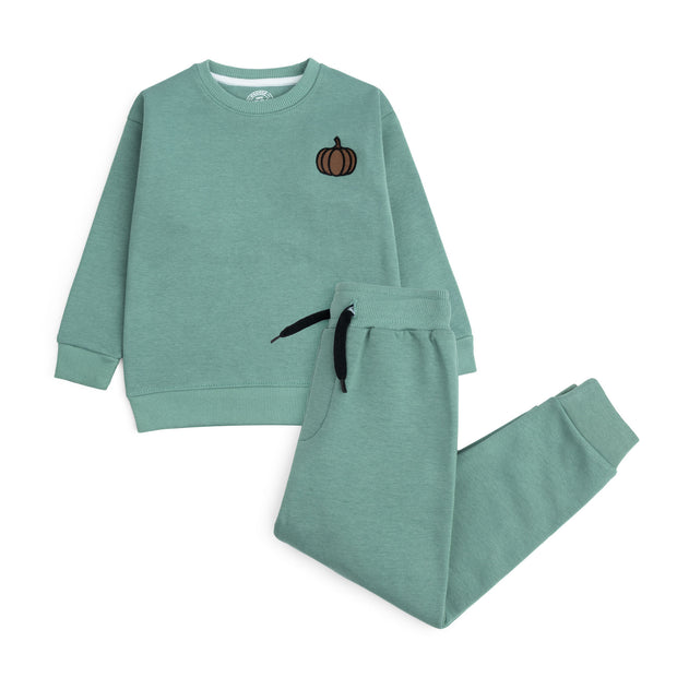Mint green boys’ fleece sweatshirt and joggers set with a small embroidered pumpkin, black drawstring and ribbed cuffs.