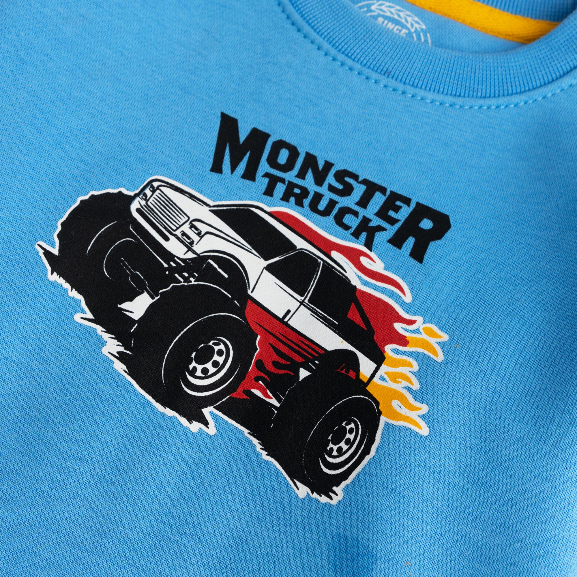 Monster truck graphic detail on NEON blue boys sweatshirt