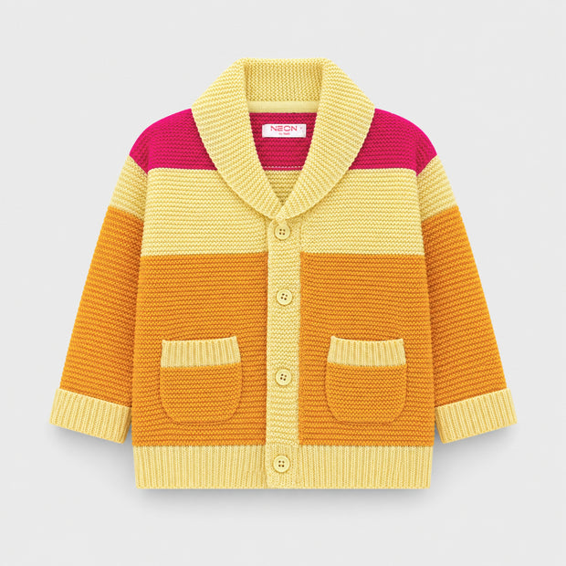 Front view of a girls color-block cardigan featuring butter-yellow, golden-orange and fuchsia-pink panels, a wide folded collar, buttons and two patch pockets.