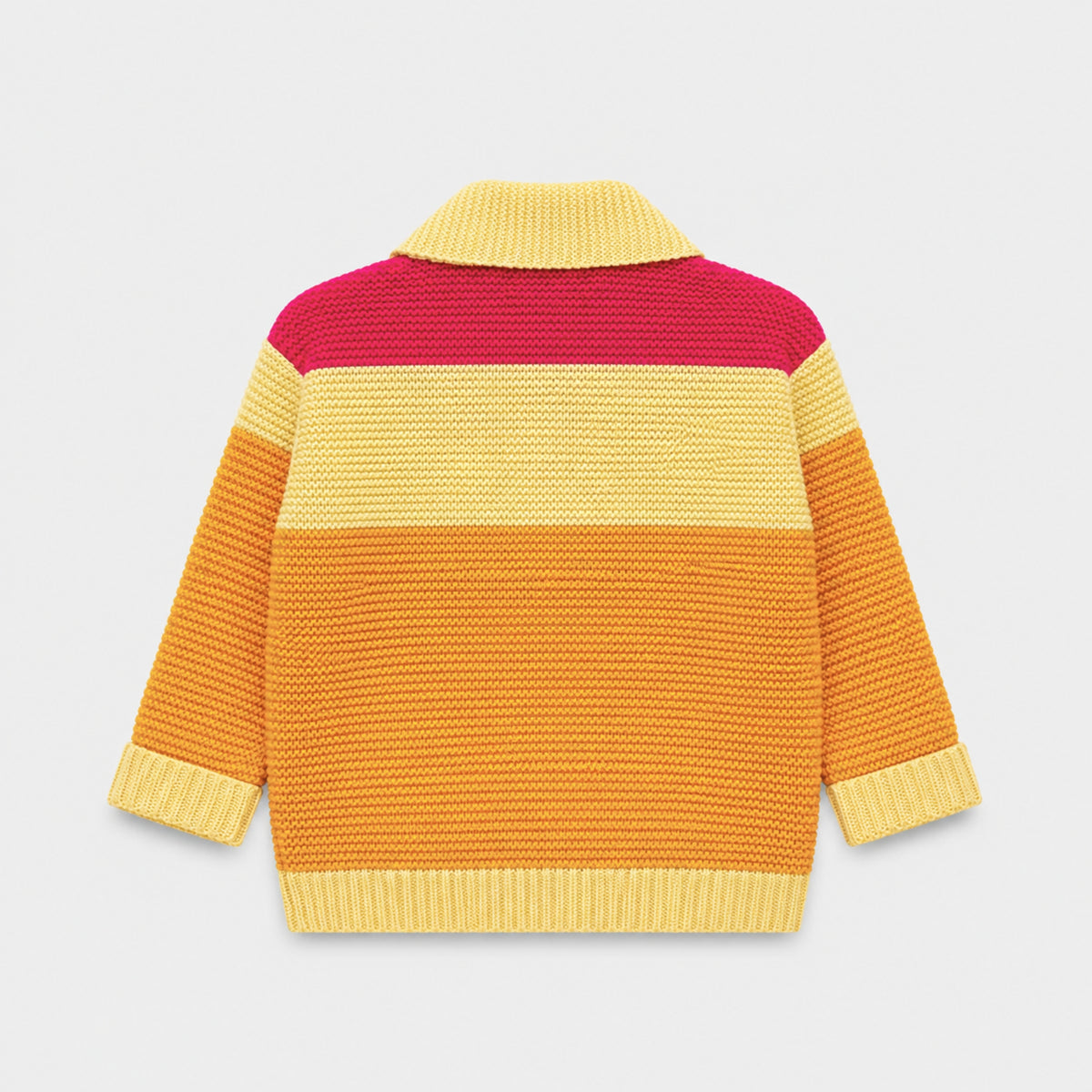 Back view of the girls acrylic cardigan, showing fuchsia-pink, butter-yellow and golden-orange color-block panels with contrasting ribbed edges.