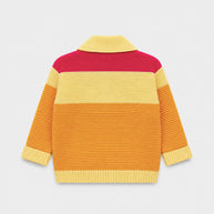 Back view of the girls acrylic cardigan, showing fuchsia-pink, butter-yellow and golden-orange color-block panels with contrasting ribbed edges.