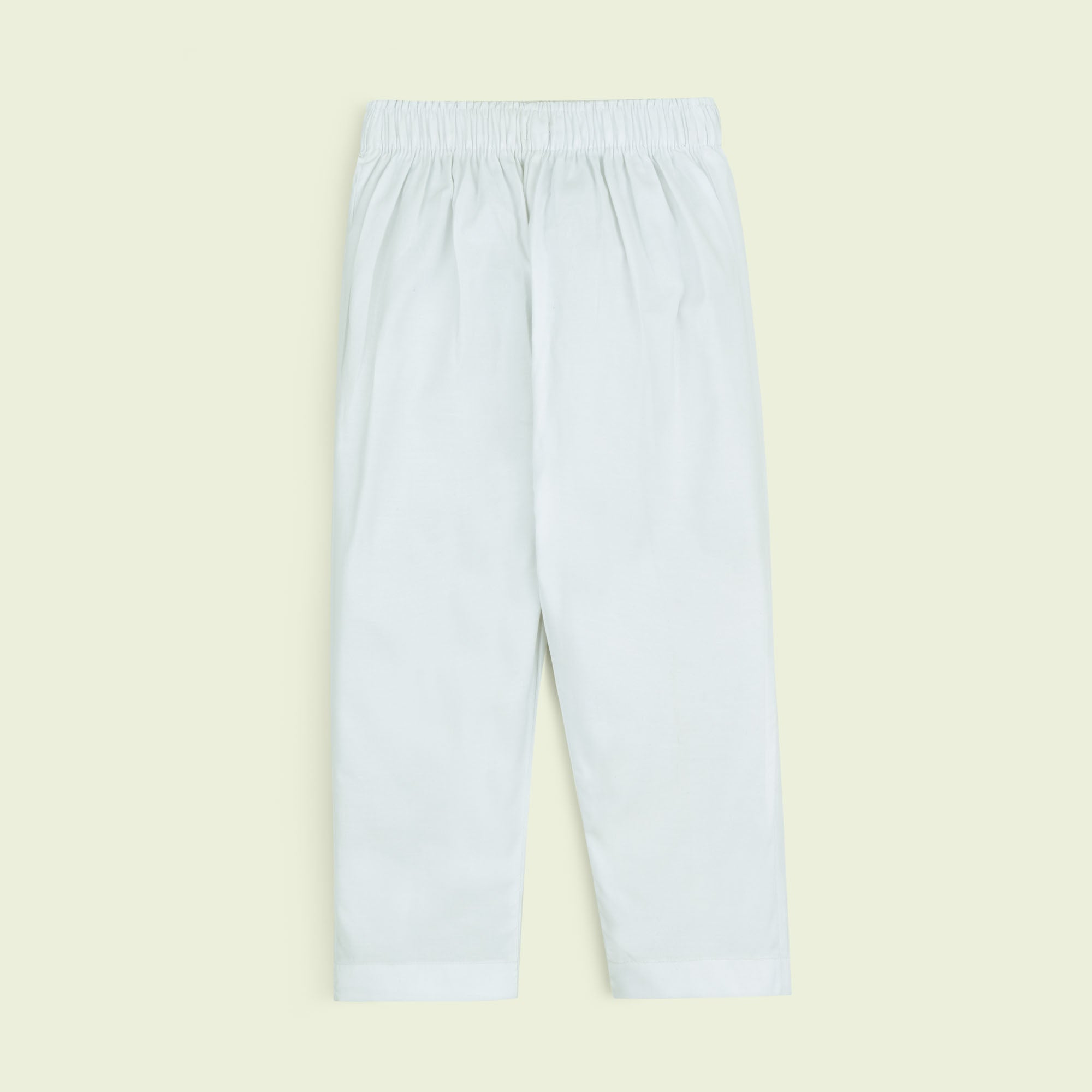 Off white cotton trousers for boys featuring a fully elasticated waistband, regular fit, plain design and straight hems.